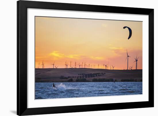 Usa, California, Rio Vista. Kiteboarder at sunset with wind farm turbines.-Merrill Images-Framed Photographic Print