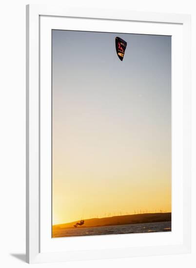 USA, California, Rio Vista, Sacramento River Delta. Kiteboarder catching air at sunset.-Merrill Images-Framed Premium Photographic Print