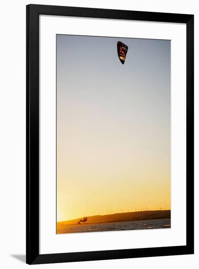 USA, California, Rio Vista, Sacramento River Delta. Kiteboarder catching air at sunset.-Merrill Images-Framed Premium Photographic Print