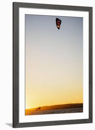 USA, California, Rio Vista, Sacramento River Delta. Kiteboarder catching air at sunset.-Merrill Images-Framed Premium Photographic Print