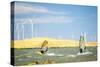 Usa, California, Rio Vista, Sacramento River Delta. Sailboarders with wind turbines.-Merrill Images-Stretched Canvas