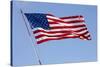 USA, California, San Diego. American flag waves above Liberty Station-Ann Collins-Stretched Canvas