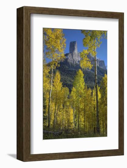 USA, Colorado, San Juan Mountains. Autumn aspen trees frame Chimney Rock.-Jaynes Gallery-Framed Photographic Print