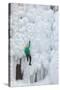 USA, Colorado, Uncompahgre National Forest. Climber ascends ice-encrusted cliff face.-Jaynes Gallery-Stretched Canvas