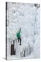 USA, Colorado, Uncompahgre National Forest. Climber ascends ice-encrusted cliff face.-Jaynes Gallery-Stretched Canvas