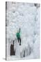 USA, Colorado, Uncompahgre National Forest. Climber ascends ice-encrusted cliff face.-Jaynes Gallery-Stretched Canvas
