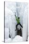 USA, Colorado, Uncompahgre National Forest. Climber ascends icy cliff face.-Jaynes Gallery-Stretched Canvas