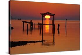 USA, Florida, Apalachicola, Sunrise at an old boat house at Apalachicola Bay.-Joanne Wells-Stretched Canvas