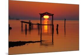 USA, Florida, Apalachicola, Sunrise at an old boat house at Apalachicola Bay.-Joanne Wells-Mounted Premium Photographic Print