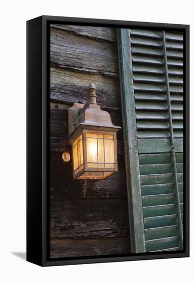 USA, Florida, St. Augustine, Shutter and lantern on old house.-Joanne Wells-Framed Stretched Canvas