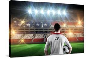 Usa Football Player Holding Ball against Stadium Full of Usa Football Fans-Wavebreak Media Ltd-Stretched Canvas