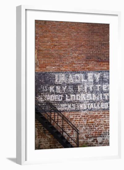 USA, Georgia, Savannah, Painting on a brick building.-Joanne Wells-Framed Photographic Print