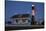 USA, Georgia, Tybee Island, Flag flying on lighthouse at Tybee Island.-Joanne Wells-Stretched Canvas