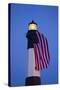USA, Georgia, Tybee Island, Flag flying on lighthouse at Tybee Island.-Joanne Wells-Stretched Canvas