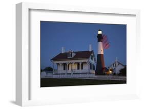 USA, Georgia, Tybee Island, Flag flying on lighthouse at Tybee Island.-Joanne Wells-Framed Photographic Print