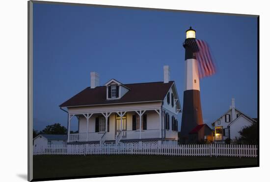 USA, Georgia, Tybee Island, Flag flying on lighthouse at Tybee Island.-Joanne Wells-Mounted Photographic Print