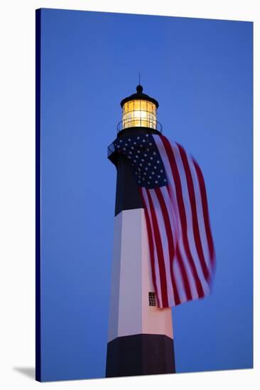 USA, Georgia, Tybee Island, Flag flying on lighthouse at Tybee Island.-Joanne Wells-Stretched Canvas