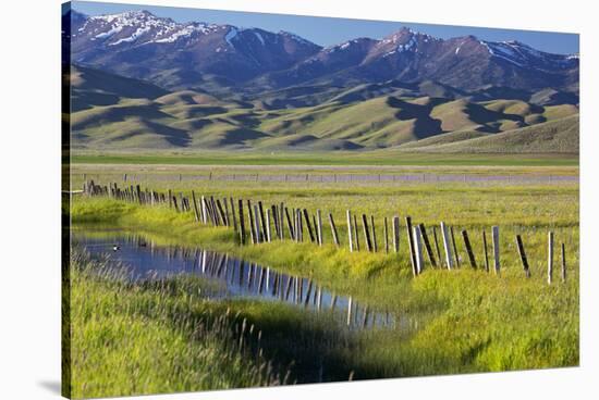 USA, Idaho, Fairfield, Camas Prairie, Creek and fence in the Camas Prairie-Terry Eggers-Stretched Canvas