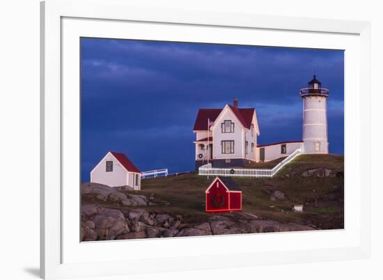 USA, Maine, York Beach, Nubble Light Lighthouse with Christmas decorations at dusk-Walter Bibikow-Framed Premium Photographic Print