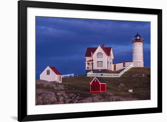 USA, Maine, York Beach, Nubble Light Lighthouse with Christmas decorations at dusk-Walter Bibikow-Framed Premium Photographic Print