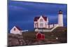USA, Maine, York Beach, Nubble Light Lighthouse with Christmas decorations at dusk-Walter Bibikow-Mounted Photographic Print