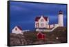 USA, Maine, York Beach, Nubble Light Lighthouse with Christmas decorations at dusk-Walter Bibikow-Framed Stretched Canvas