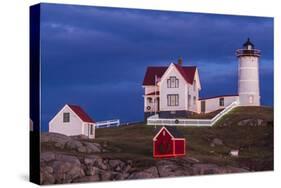 USA, Maine, York Beach, Nubble Light Lighthouse with Christmas decorations at dusk-Walter Bibikow-Stretched Canvas