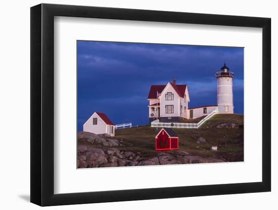 USA, Maine, York Beach, Nubble Light Lighthouse with Christmas decorations at dusk-Walter Bibikow-Framed Photographic Print