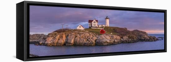 USA, Maine, York Beach, Nubble Light Lighthouse with Christmas decorations, dusk-Walter Bibikw-Framed Stretched Canvas