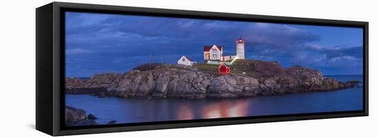 USA, Maine, York Beach, Nubble Light Lighthouse with Christmas decorations, dusk-Walter Bibikw-Framed Stretched Canvas