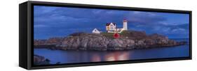 USA, Maine, York Beach, Nubble Light Lighthouse with Christmas decorations, dusk-Walter Bibikw-Framed Stretched Canvas