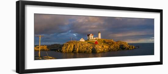 USA, Maine, York Beach, Nubble Light Lighthouse with Christmas decorations, sunset-Walter Bibikw-Framed Photographic Print