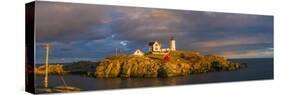 USA, Maine, York Beach, Nubble Light Lighthouse with Christmas decorations, sunset-Walter Bibikw-Stretched Canvas