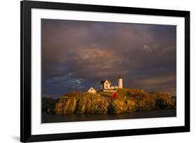 USA, Maine, York Beach, Nubble Light Lighthouse with Christmas decorations, sunset-Walter Bibikow-Framed Premium Photographic Print