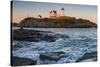 USA, Maine, York, Nubble Light Lighthouse at dusk-Walter Bibikow-Stretched Canvas