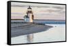 USA, Massachusetts, Nantucket Island, Brant Point Lighthouse with a Christmas wreath at dusk.-Walter Bibikow-Framed Stretched Canvas