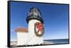 USA, Massachusetts, Nantucket Island, Brant Point Lighthouse with a Christmas wreath.-Walter Bibikow-Framed Stretched Canvas