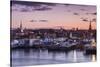 USA, Massachusetts, Newburyport, skyline from the Merrimack River at dusk-Walter Bibikow-Stretched Canvas