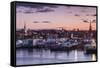 USA, Massachusetts, Newburyport, skyline from the Merrimack River at dusk-Walter Bibikow-Framed Stretched Canvas