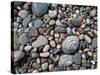 USA, Michigan. Polished pebbles on the shore of Lake Superior.-Anna Miller-Stretched Canvas