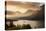 USA, Montana, Glacier NP. Sunrise pierces clouds over St. Mary Lake.-Don Grall-Stretched Canvas