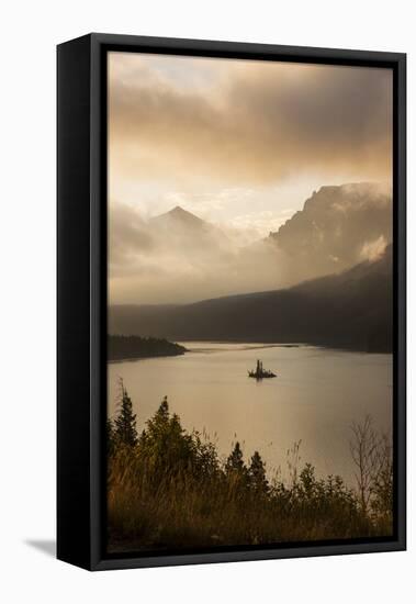 USA, Montana, Glacier NP. Sunrise pierces clouds over St. Mary Lake.-Don Grall-Framed Stretched Canvas