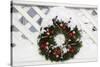 USA, New England, Massachusetts, Reading, Christmas wreath on fence-Lisa Engelbrecht-Stretched Canvas