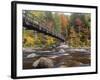 Usa, New Hampshire, Lincoln, fall foliage and suspension bridge over the Pemigewasset River.-Merrill Images-Framed Photographic Print