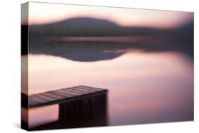 Usa, New Hampshire, Lyme. Dock and reflection of mountain in Hinman Pond at sunset.-Merrill Images-Stretched Canvas