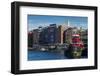 USA, New Hampshire, Portsmouth, waterfront buildings with tugboat-Walter Bibikow-Framed Photographic Print