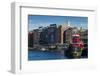 USA, New Hampshire, Portsmouth, waterfront buildings with tugboat-Walter Bibikow-Framed Photographic Print