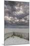 USA, New Jersey, Cape May National Seashore. Beach fence and stormy sunrise.-Jaynes Gallery-Mounted Photographic Print