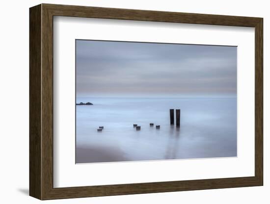 USA, New Jersey, Cape May National Seashore. Beach pilings on stormy sunrise.-Jaynes Gallery-Framed Photographic Print