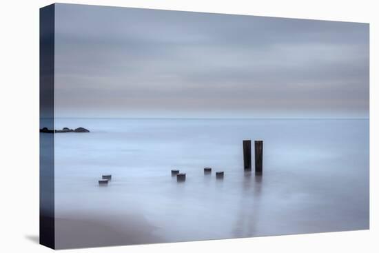 USA, New Jersey, Cape May National Seashore. Beach pilings on stormy sunrise.-Jaynes Gallery-Stretched Canvas